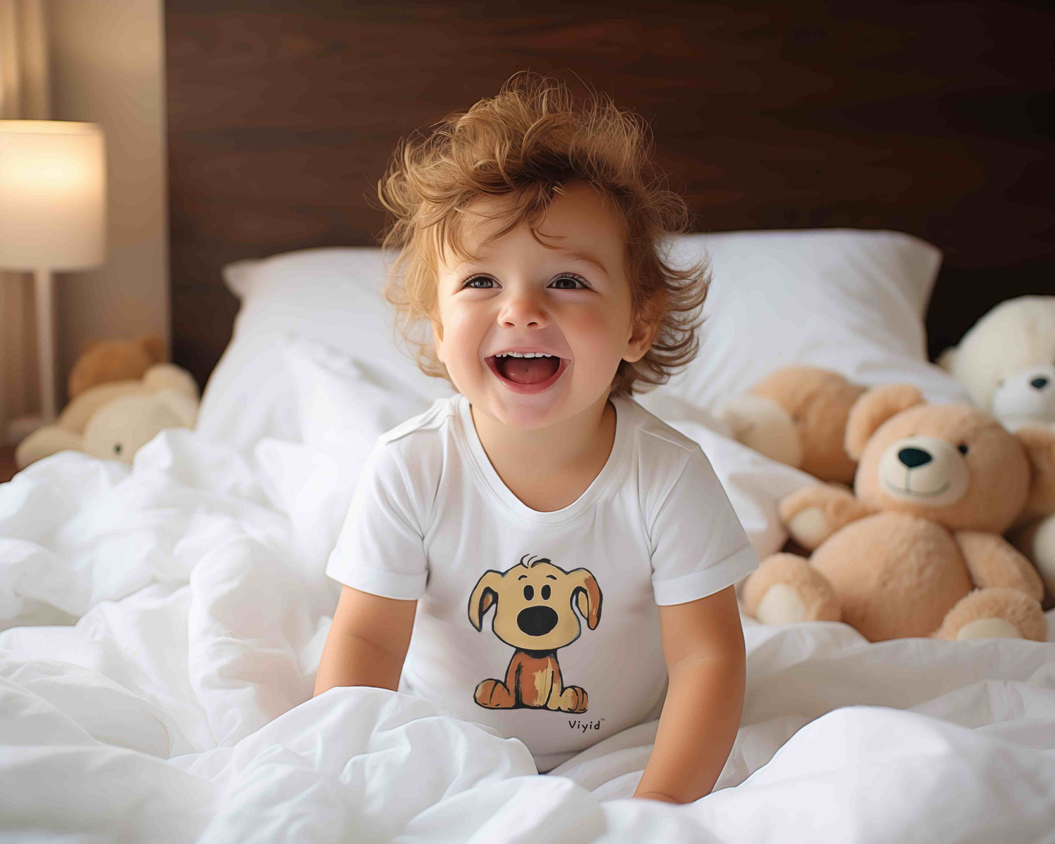 baby t-shirt collection cover image of a baby wearing a white t-shirt of a cartoon beagle on the bed